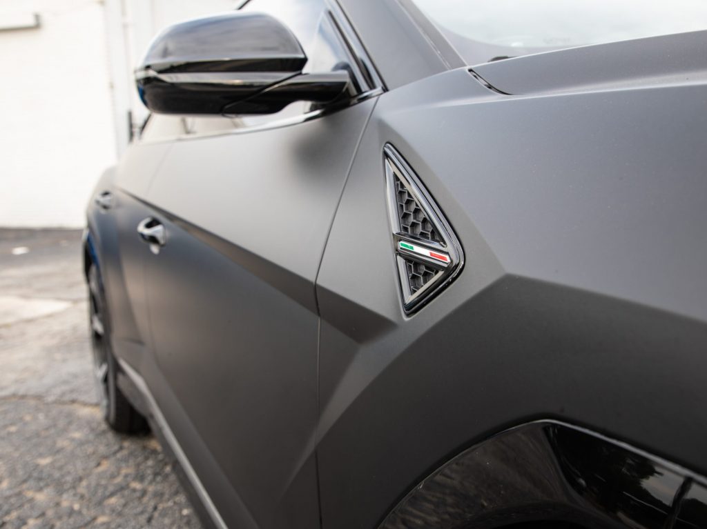 Black Lamborghini Urus emblem